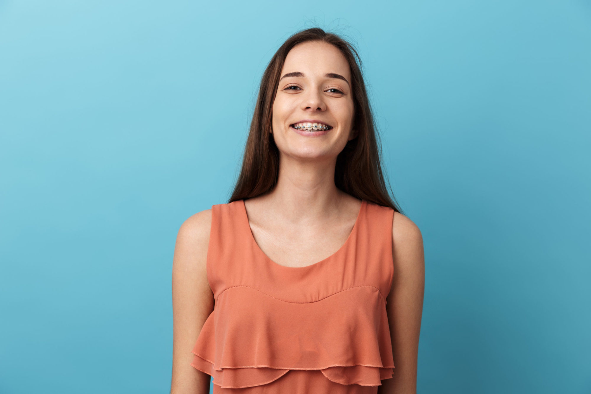 Cute lovely young girl standing isolated Orthodontist Palmetto Bay