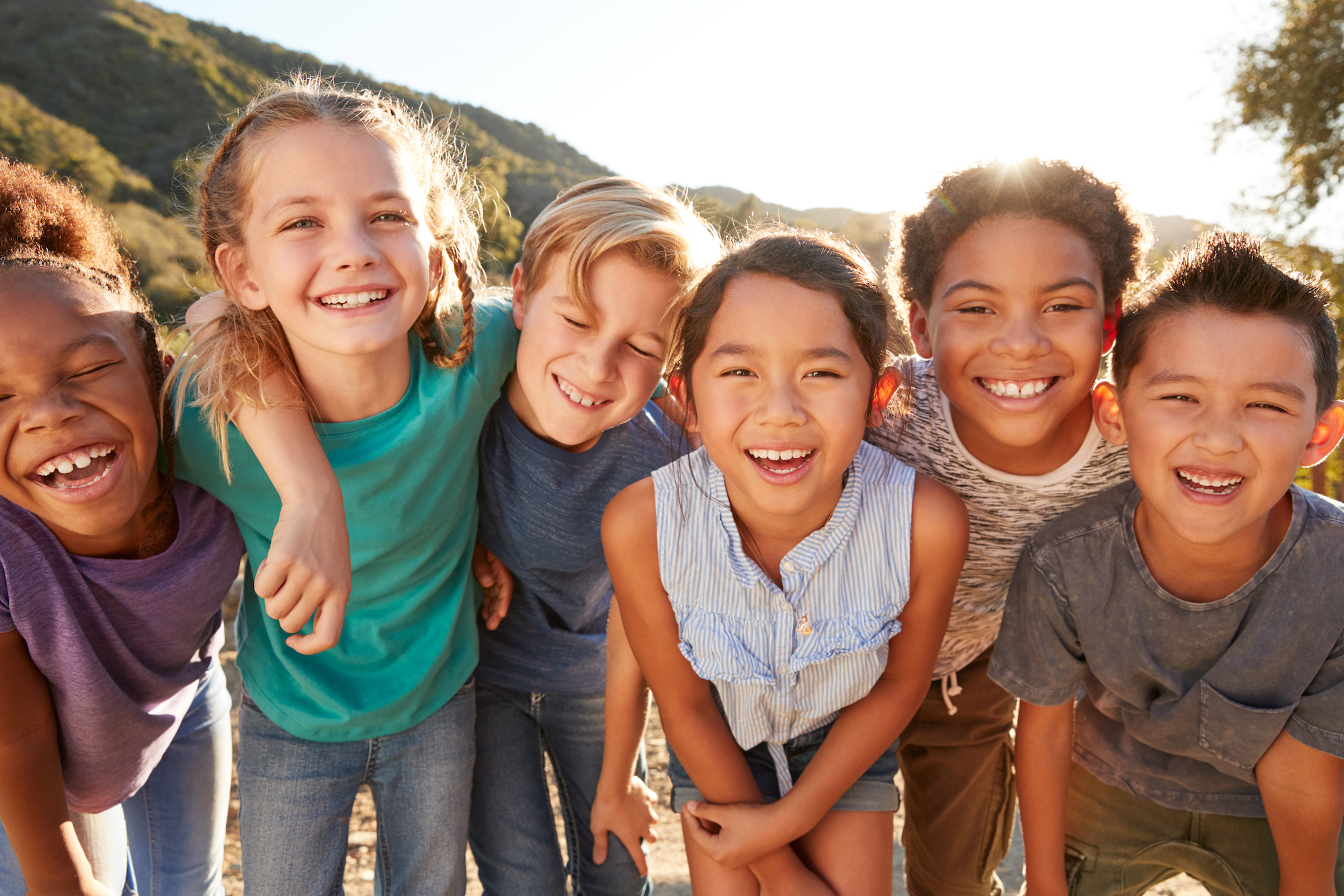 Portrait Of Multi-Cultural Children Hanging Out With Friends In Countryside Together Orthodontics for All Ages